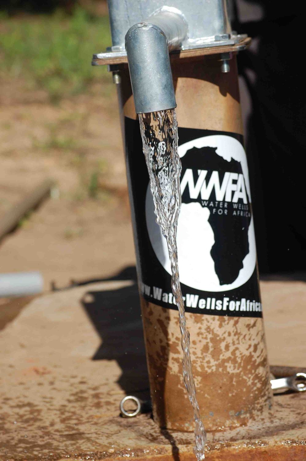 Clear water flows from the fixed borehole.
